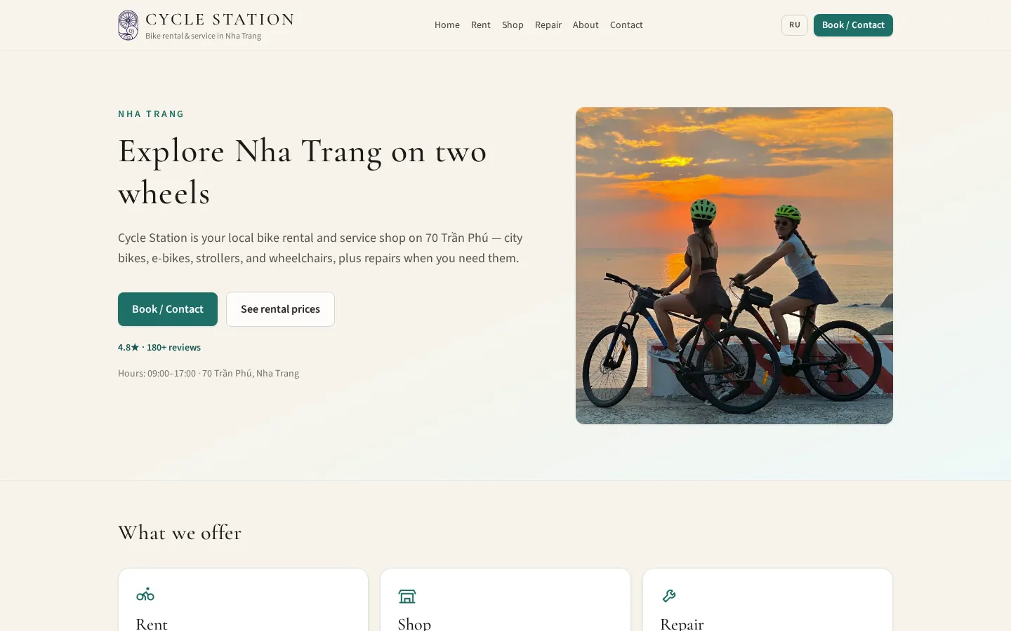 The Cycle Station home page on desktop: the heading “Explore Nha Trang on two wheels”, Book / Contact and rental-price buttons, and a photo of two cyclists at sunset.
