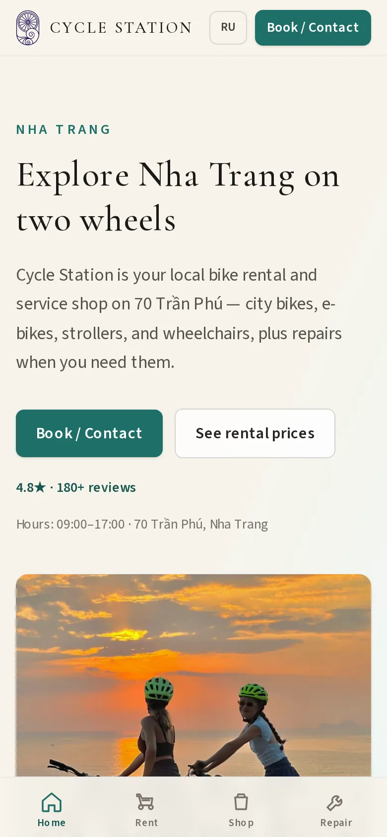 The Cycle Station site on a phone: the heading “Explore Nha Trang on two wheels”, Book / Contact and rental-price buttons, and a photo of two cyclists at sunset.
